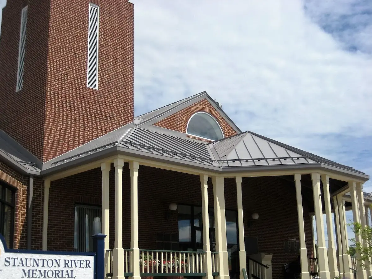 Skilled roofing craftsmen working on a residential roof in Little Canada